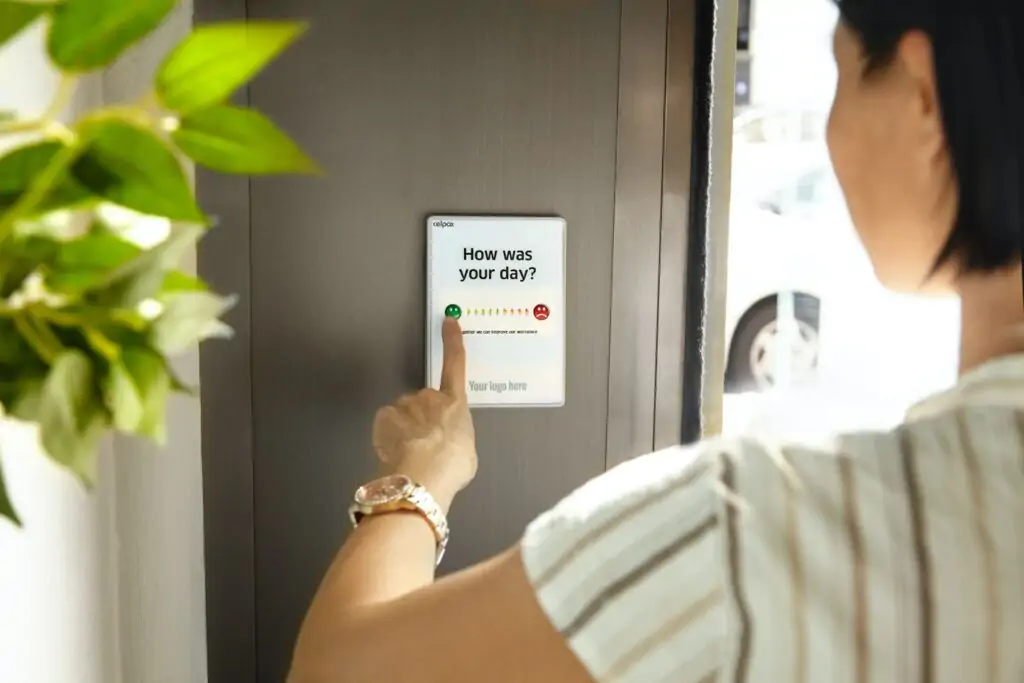 Person filling out a survey on a tablet